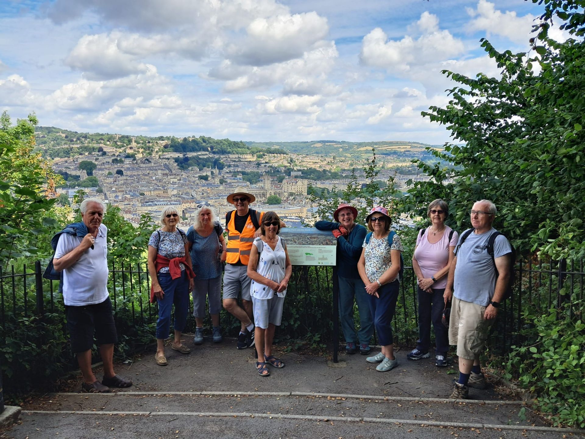 group of walkers in front of a view of bath